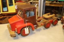 A wooden hand-made normal control Volvo NL Series 6-wheel Tractor Unit in iroko and beech. The model