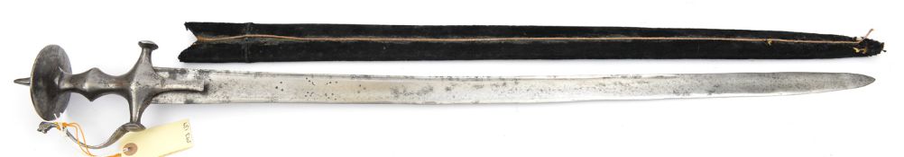 An 18th century tulwar hilted Indian sword, very slightly curved broad blade 33”, with narrow back