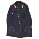 A Third Reich three quarter length coat, dark blue with crimson piping, collar patches and crimson