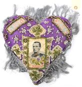 A heart shaped pin cushion with inset silk portrait of Maj. Gen Wauchope, killed in action at