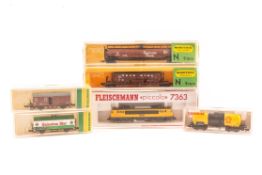 10 N gauge locomotives and freight wagons etc by Fleischmann and Minitrix. A DB class 050 2-10-0