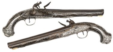 A good quality pair of late 18th century Turkish 18 bore silver mounted flintlock holster pistols,