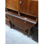 AN OAK DROP LEAF TABLE