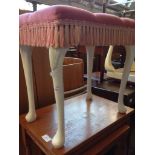 A DRESSING TABLE STOOL