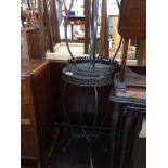 A PAIR OF COLLAPSIBLE ROUND OCCASIONAL TABLES