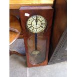 A MAHOGANY CASED WALL CLOCK