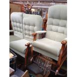 A 2 PIECE WOOD FRAMED AND GREEN UPHOLSTERED SUITE AND ANOTHER ARMCHAIR