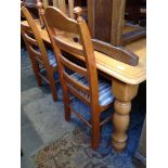 LIGHT WOOD TABLE AND FOUR LADDER BACK CHAIRS. L182CM