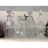 SEVEN GLASS DECANTERS D5