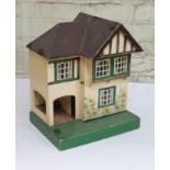 A Triang mock Tudor dolls house, height 42cm. CONDITION REPORT - general wear throughout.