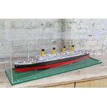 A scratch built wooden model of RMS Titanic within perspex case, total length 122cm. CONDITION