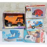 5 vintage toys comprising a Mogul Dumptruck, Little Betty Debutante sewing machine, Take-a-Part