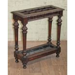 A carved oak stick stand circa 1900, length 69cm, depth 30cm & 79.5cm.