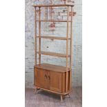 An Ercol blonde elm and beech room divider or bookcase with lower cupboard, width 86cm, depth 40.5cm