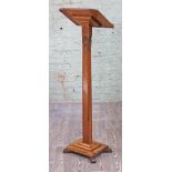 An Arts & Crafts carved oak lectern, monogrammed and dated (see image), height 133cm.