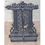 A Victorian cast iron stick stand with later tray, height 68cm.