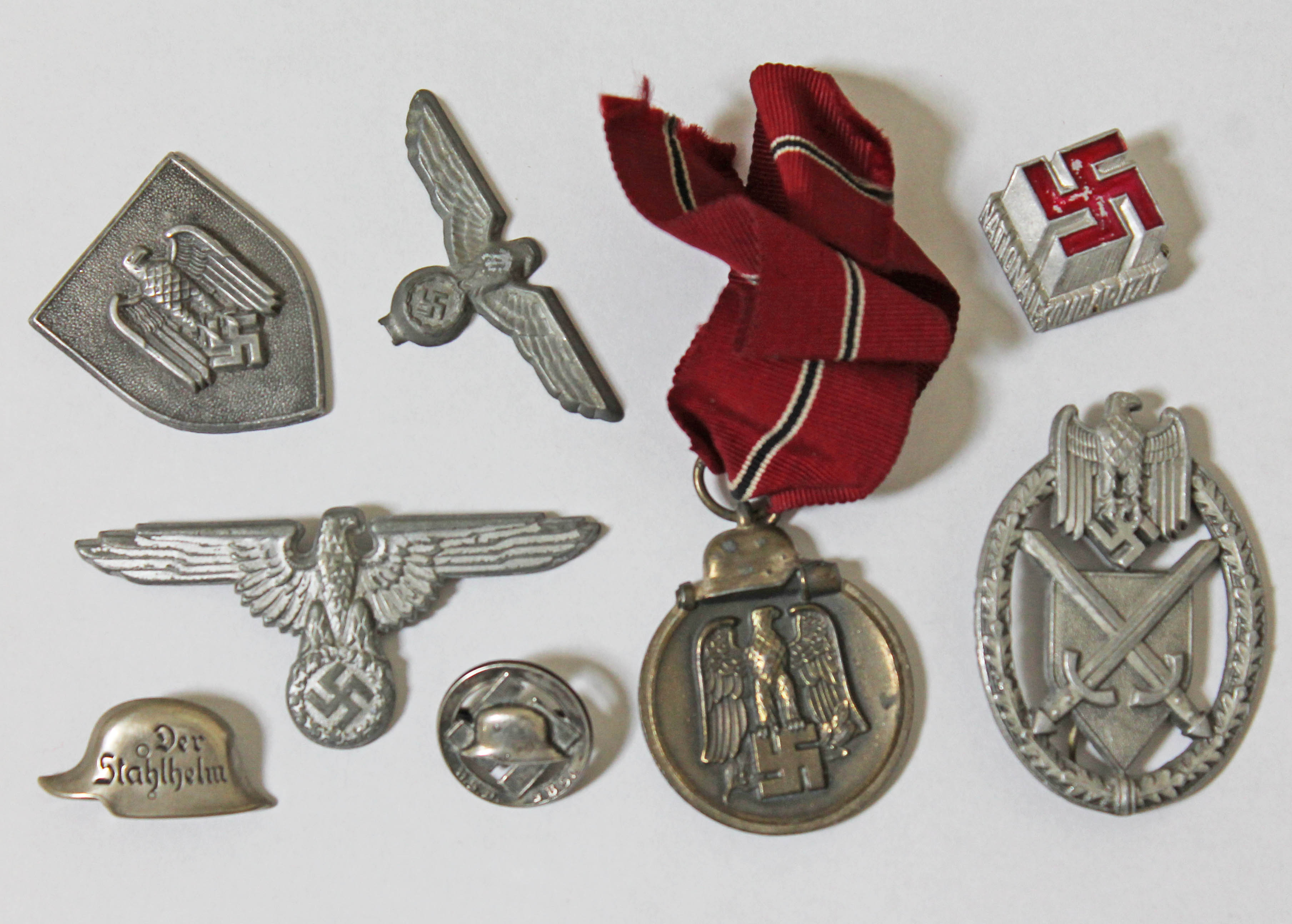 German WWII Nazi medals and badges including an eastern front medal.