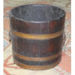 A Georgian brass bound oak barrel/bucket, height 28cm.