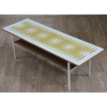 A retro coffee table circa 1960 with abstract pattern in green on white top, length 114cm, depth