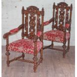 A pair of carved oak armchairs, early 20th Century, width 65cm, depth 60cm & height 114cm.