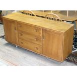 An Ercol blonde elm sideboard, length 156cm, depth 45cm & height 58.5cm.