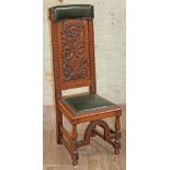 A carved oak prie dieu chair circa 1900, height 122cm.