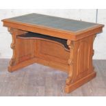 A Victorian Gothic Revival oak library table or desk, width 132cm, depth70cm & height 82cm.