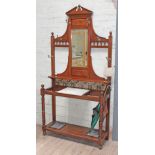 A late Victorian hallstand with Aesthetic style tiles, width 107cm, depth 37cm & height 218cm.