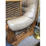 A BROWN LEATHER WOOD FRAME SETTEE