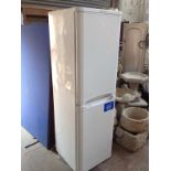 AN INDESIT FRIDGE FREEZER