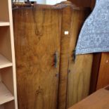 A WALNUT VENEERED WARDROBE