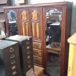 CARVED WALNUT EDWARDIAN WARDROBE WITH CENTRE DRAWERS. W197CM