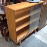 A VENEERED GLASS SLIDING BOOKCASE