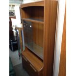 A GLASS SLIDING VENEER CABINET BOOKCASE