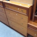 A TALL CHEST OF DRAWERS