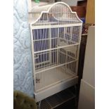 A LARGE WHITE BIRD CAGE