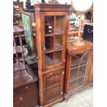 AN AGED OAK CORNER DISPLAY CABINET H170CM W50CM D70CM