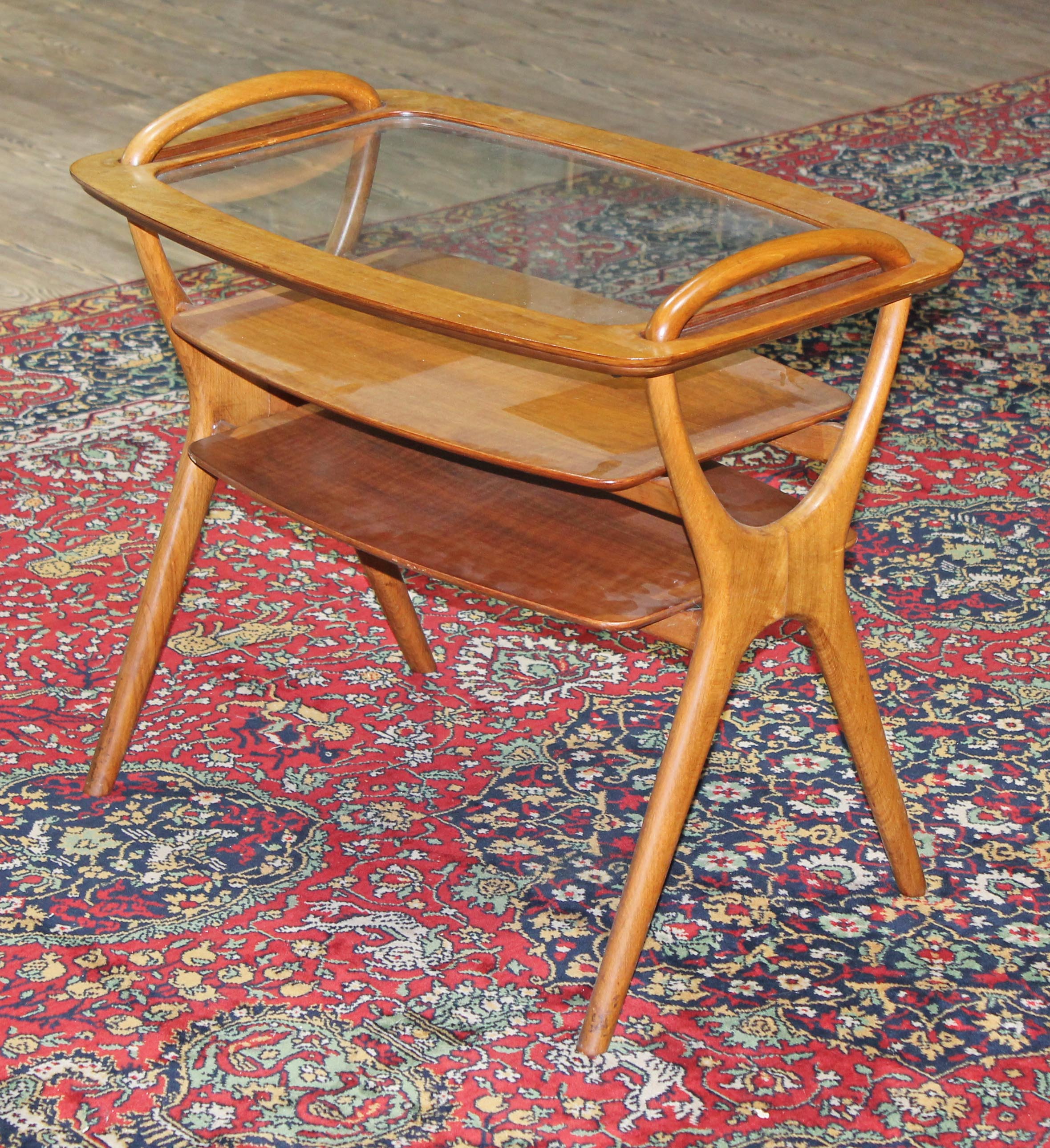 A 1950s retro walnut three tier occasional table with removable tray top, length 75cm, depth