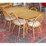 An Ercol blonde elm and beech extending dining table and six chairs (no leaf), min. table