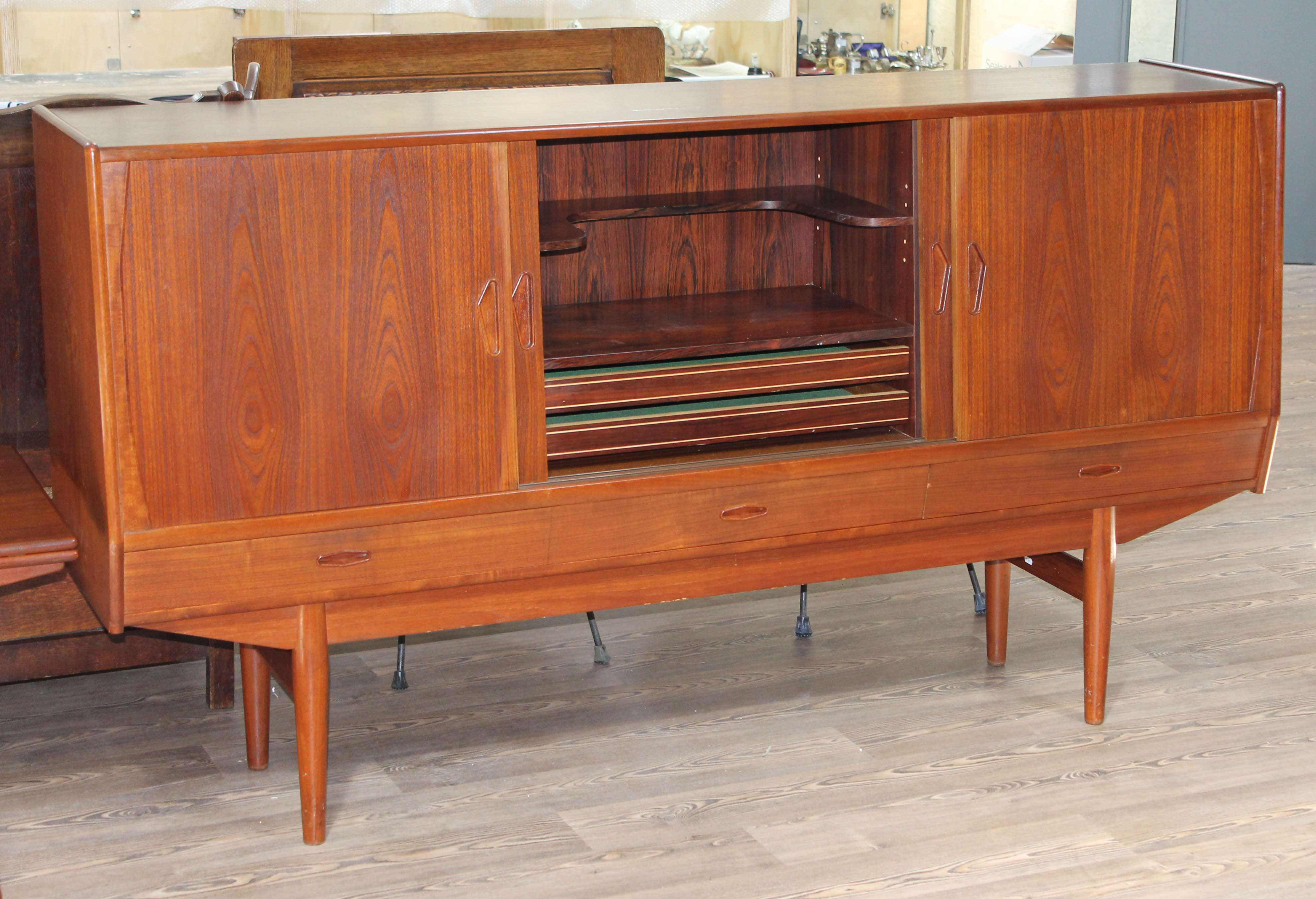 A Danish teak 1960s sideboard with slide doors revealing fitted central cupboard and shelves - Image 2 of 2