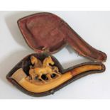 A carved meerschaum pipe in case.