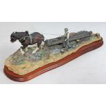 A Border Fine Arts model "Logging" by Ayres, length 47cm. CONDITION REPORT - break and repair to