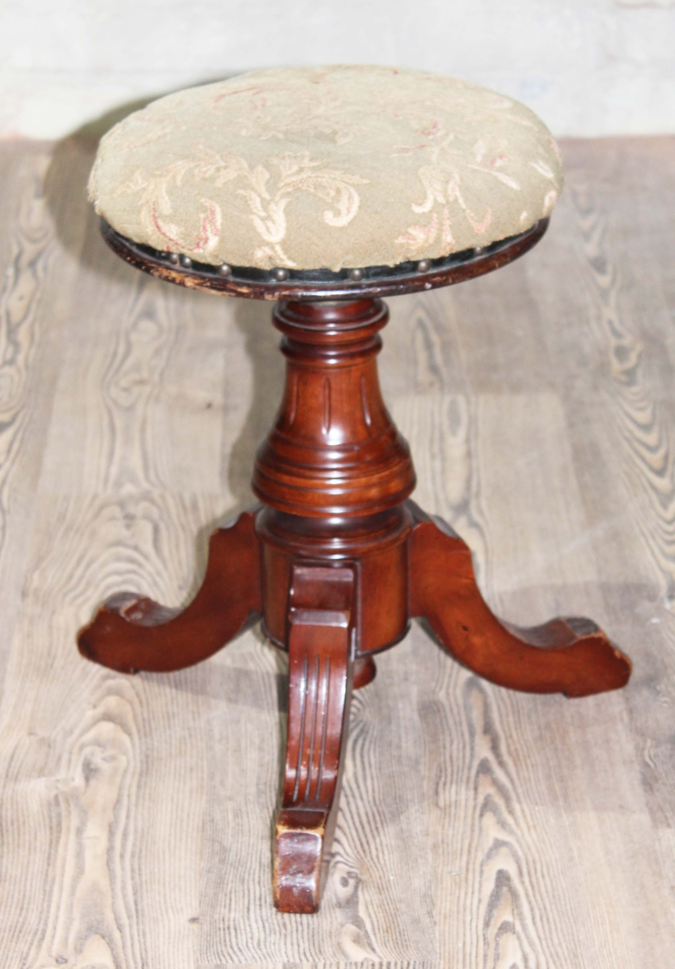 A Victorian adjustable piano stool.