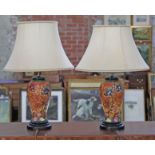 A pair of modern Moorcroft Cosmos pattern pottery table lamps with tube lined floral decoration,