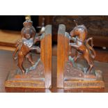 A pair of carved oak Heraldic style bookends.