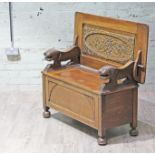 An oak monks bench circa 1920, width 106.5cm, depth 51cm & height 67cm.