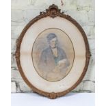 19th Century School, pencil drawing of a young gentleman sat reading, oval 24cm x 30cm, glazed and