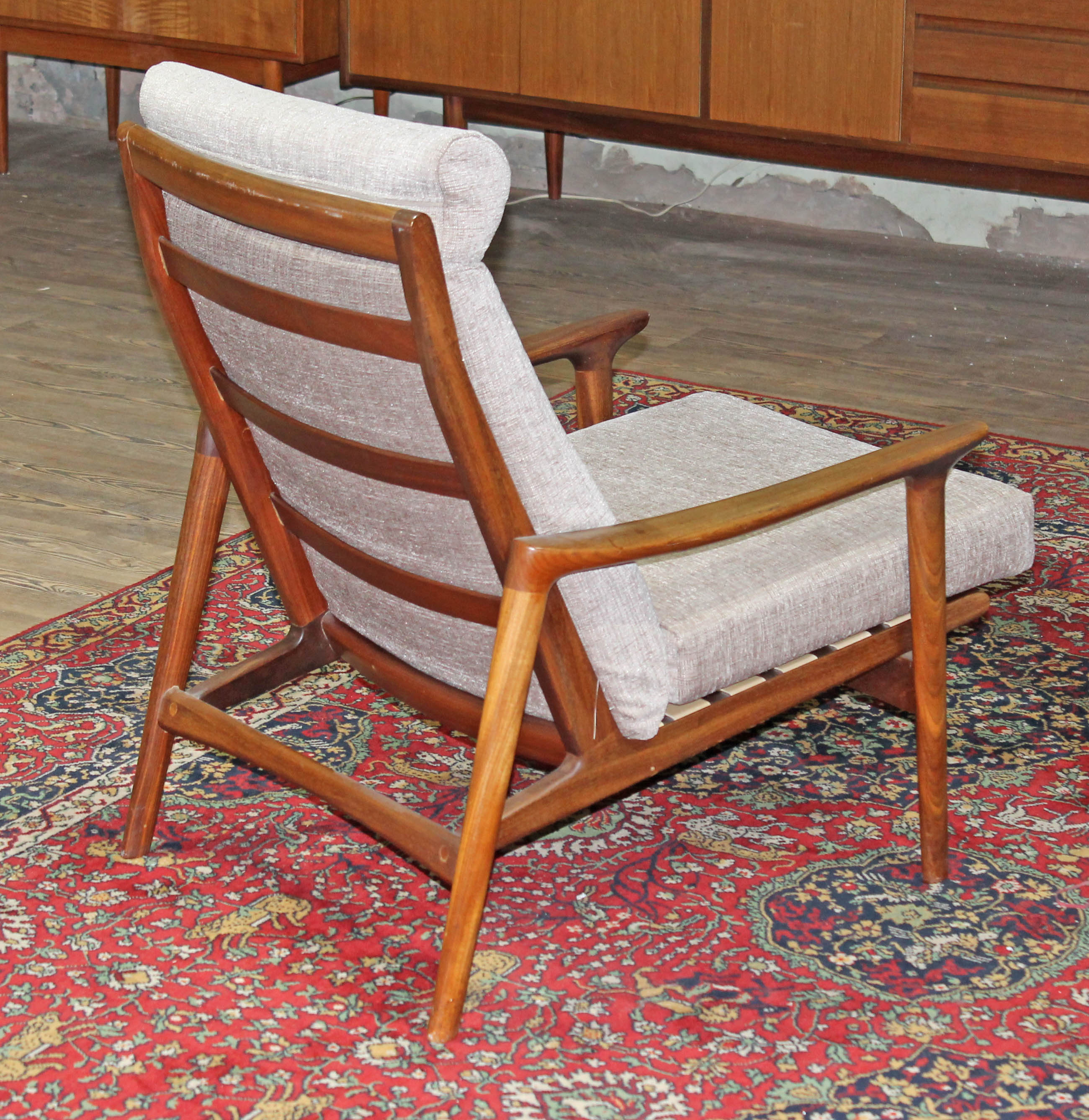 A 1960s Danish style teak lounge chair in the manner of Arne Vodder, width 67cm, depth 86cm & height