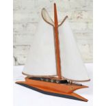 A 1950s retro table formed as a sailing boat, height 51.5cm & height 53cm.