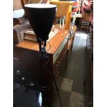 A METAL TRIPOD LAMP